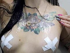 dominatrix nika bathes and teases with her tattooed tits 😈