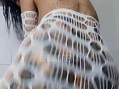 Tattooed brunette intensely dancing funk with bold moves