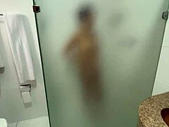 Emotional redhead handjob in shared hostel bathroom
