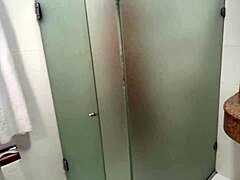 Emotional redhead handjob in shared hostel bathroom