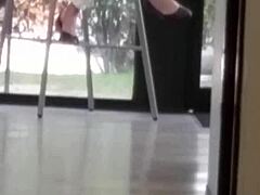 mature woman engages in shoe play with feet and shoes