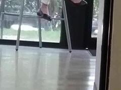 mature woman engages in shoe play with feet and shoes