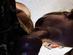 a milf gives deepthroat blowjob in close up.