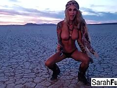 The sexy tattooed MILF STRIPS on the dry bed lake, ripping clothes.