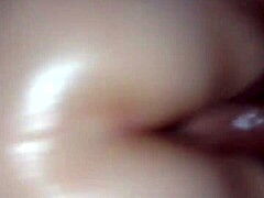 Oiled pussy fucked by cock in detailed scene