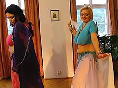 Two big-breasted belly dancers strip naked for your viewing pleasure