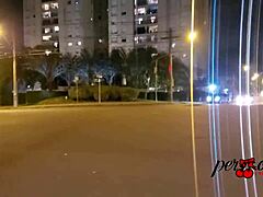 Brazilian woman boldly exposes breasts outside car in Porto Alegre public