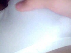 Young woman explores self-pleasure with nylon leggings