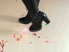 milf in lingerie pops small balloons with high heels while dominating with feet