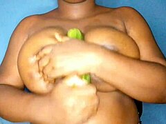 Ebony Woman Sensually Caresses Her Large Black Breasts