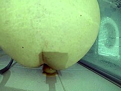 a big slave gets roughly fucked with bloody dildo in shower