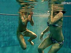 Teen brunette poses erotically in pool, contrasting underwater and above, russian babe bathing