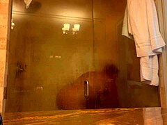 Mistress Danie relaxes in a steamy shower at PCB