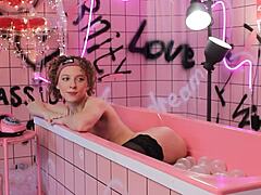 anita bathes in pink trash behind scenes
