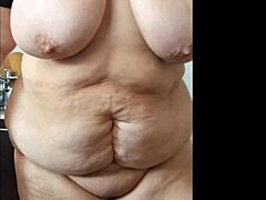 Voluptuous Latina with big natural tits undresses in the kitchen