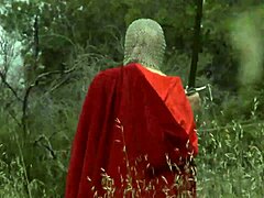 Cosplay babe masturbating with dildo on grass outdoors