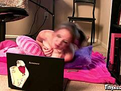 Tiny Red Slut Teases With Natural Tits