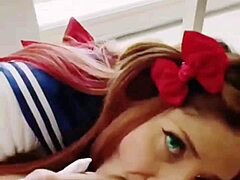 A busty babe in sailor uniform pleasuring herself