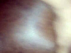 Intimate moments on the couch during a passionate encounter.