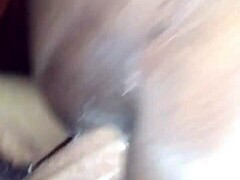 Intimate moments on the couch during a passionate encounter.