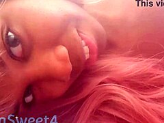 Stunning ebony woman pleasures her pussy with a big dildo