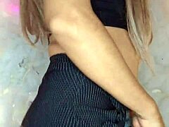 Beautiful transgender woman strokes her penis
