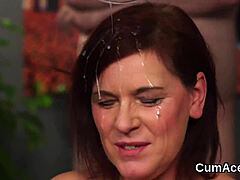 Lustful woman receives a massive ejaculation on her face and consumes every last drop