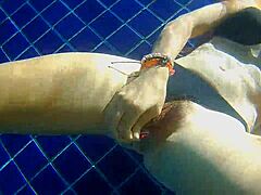 Three panties stuffed in my pussy while fucking black dildo in public pool.