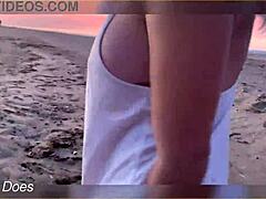 Flashing big tits under the glowing sunset by the shore