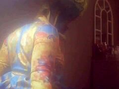 A gorgeous black woman straddling a massive white shaft