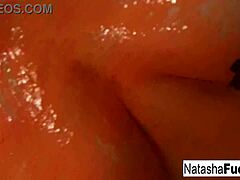 Busty Natasha Nice shoots fun black light video