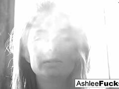 Sultry ashlee graham flaunts her natural assets while enjoying a cigarette