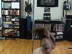 Blonde strips black and white skirt in seductive tattooed dance