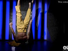 wow, this hot young guy does an acrobatic strip tease on the pole, ripping clothes off 😏
