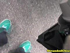 A hitchhiking girl gives a blow job to the driver who picked her up.