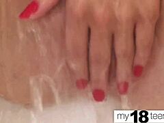 A hot brunette gets an orgasm by stroking her wet pussy