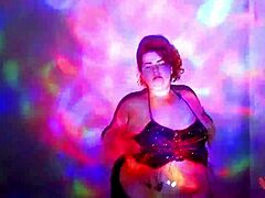 Plump redhead BBW strips naked, ripping clothes in oily dance