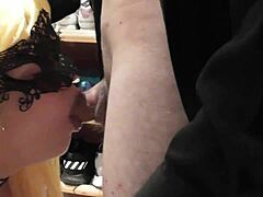 blonde performs blowjob in group setting