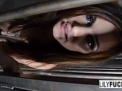 Lily fingers her wet pussy in jail