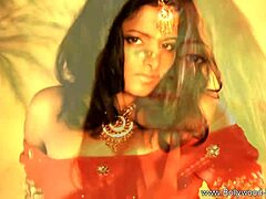 Exotic Bollywood brunette undresses sensually