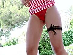 black goddess teases in high heels and miniskirt.