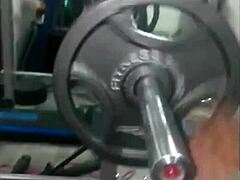 Ebony gives a head while doing a bench press workout