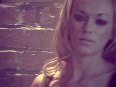 a blonde sucks off a tied-up guy in bdsm mask gear