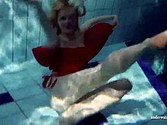 Russian Teen Lucie Swimming Underwater in Pool.