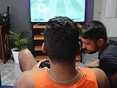 A black guy helps a Latino man to cum on his face