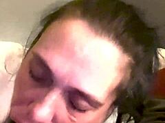 A mature black man gets a blowjob from a small woman