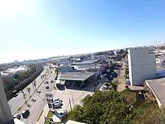 Naked Woman Poses At Hotel Window Near Airport