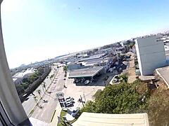 Naked Woman Poses At Hotel Window Near Airport