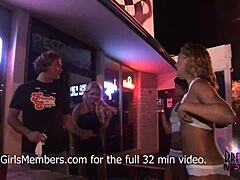 College babes show off their bodies in a beach bar competition