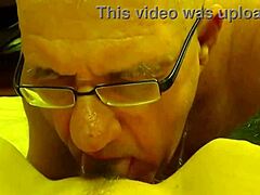 A mature man enjoys a sensual cunnilingus with his wife